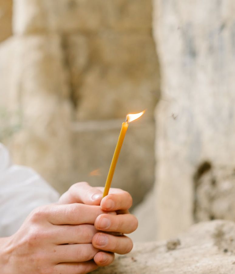 Hands in a mindful gesture over a calm background, symbolizing inner peace.